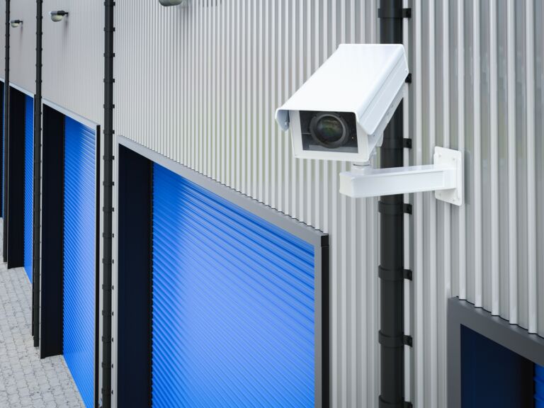 A security camera with audio recording monitoring a storage Facility